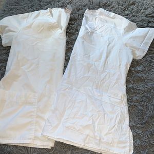 2 white scrub tops